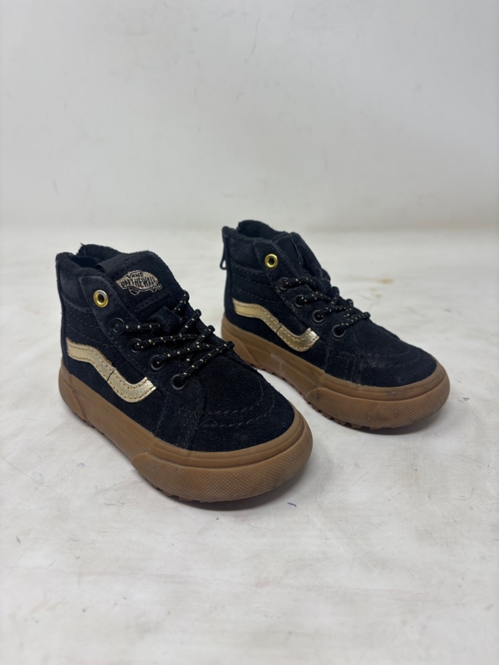 Vans Black High-Top Sneakers with Gold Stripe and Gum Sole